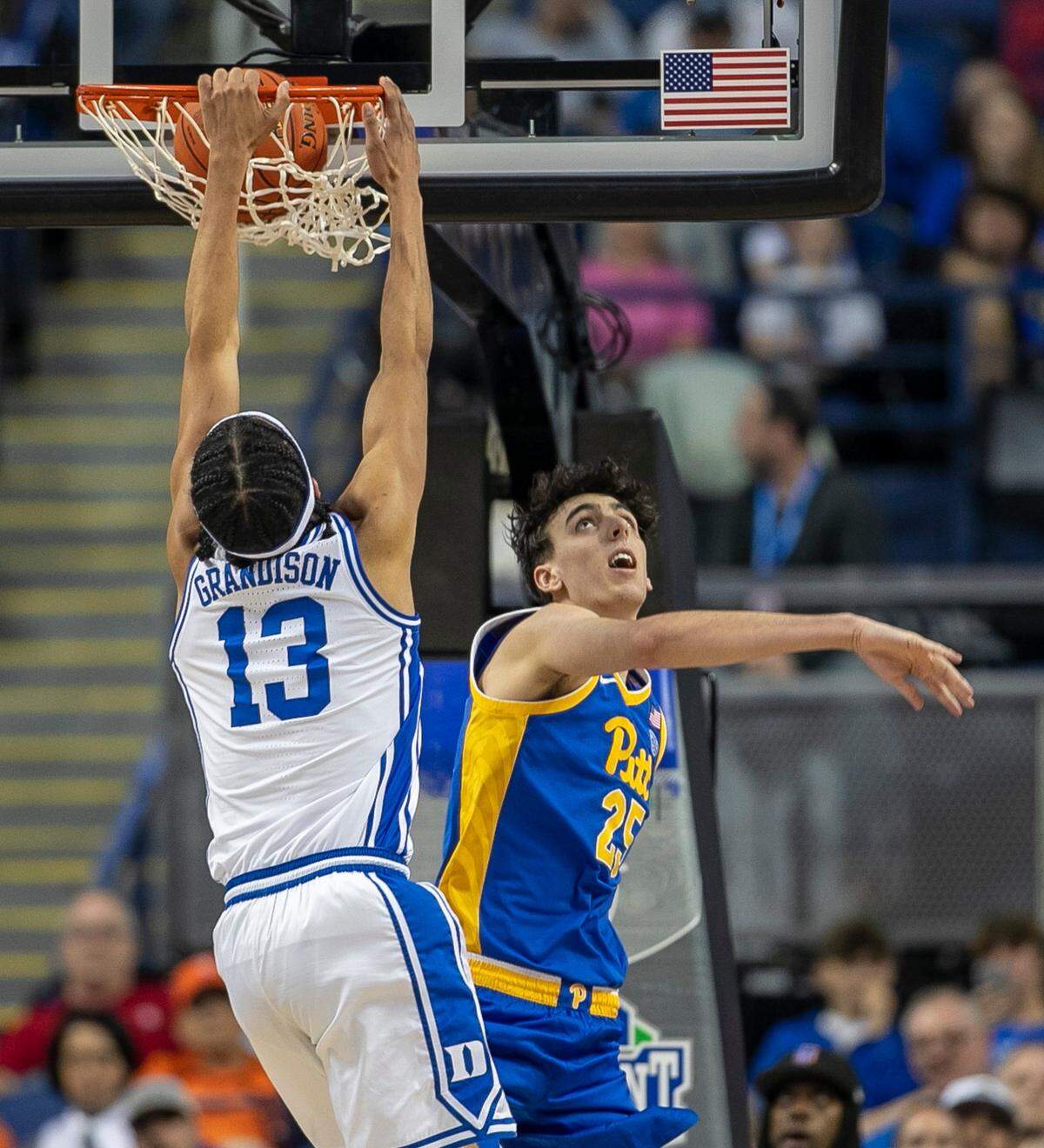 Duke’s Jacob Grandison (13) dunks over Pittsburgh’s Guillermo Diaz Graham (25) in the second half during the third round of the ACC Tournament on Thursday, March 9, 2023 at the Greensboro Coliseum in Greensboro, N.C.