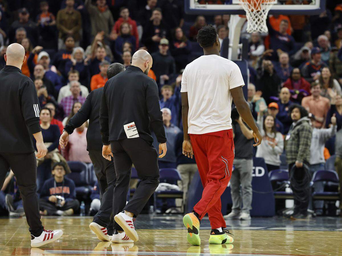 N.C. State's Scottie Ebube walks off the court after being ejected following a skirmish in the the second half of the Wolfpack’s 90-61 loss to Virginia on Thursday, Feb. 24, 2026, at John Paul Jones Arena in Charlottesville, Va. 