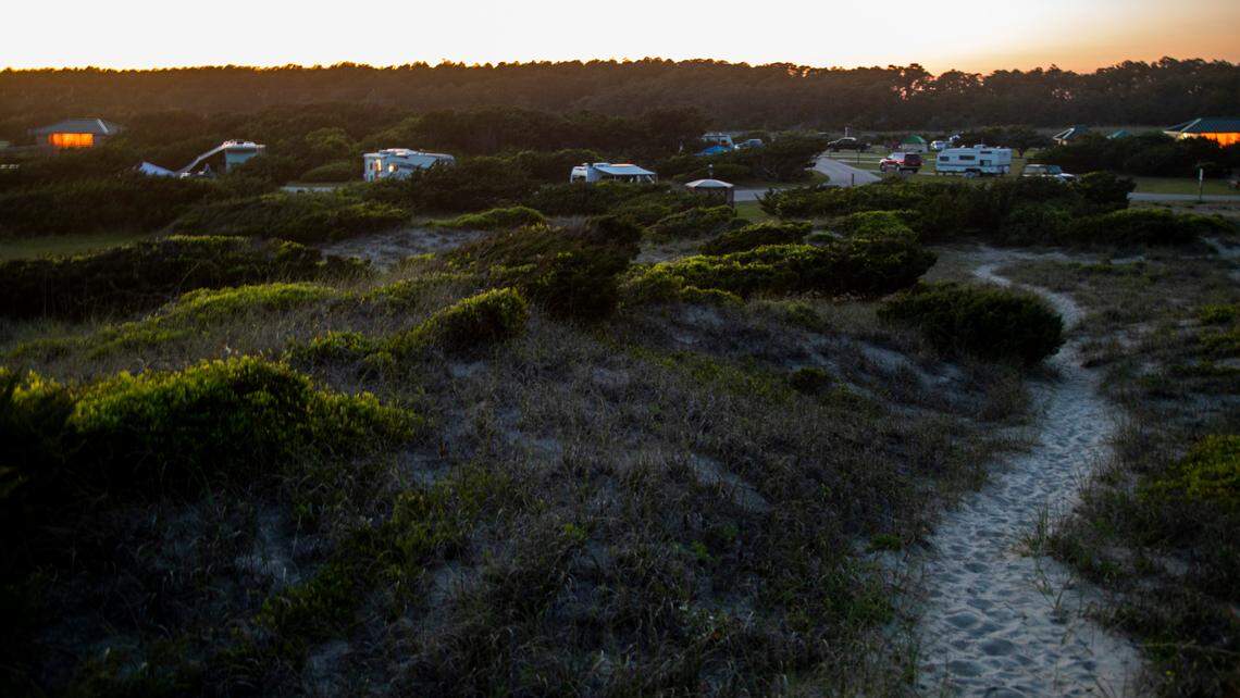 The sun sets on Ocracoke Campground on the Cape Hatteras National Seashore Tuesday, May 18, 2022.