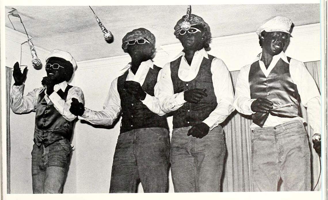 A photo from a page in a 1977 Wake Forest University yearbook shows four young men in blackface.