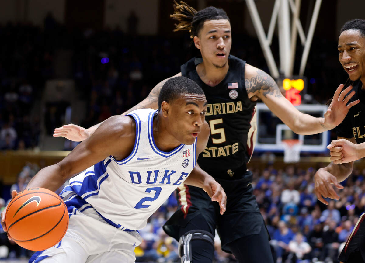 Duke’s Jaylen Blakes drives past Florida State’s De’Ante Green during the first half of a men’s basketball game at Cameron Indoor Stadium on Saturday, Dec. 31, 2022, in Durham, N.C.