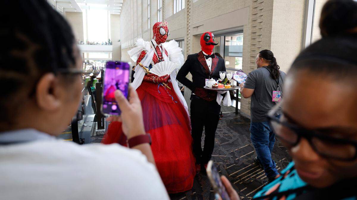 Attendees at GalaxyCon Raleigh get their photos taken at the Raleigh Convention Center Saturday, July 27, 2024.