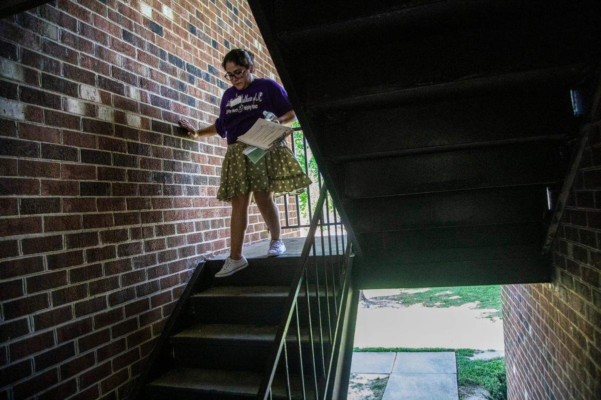 Idalia Arellano canvasses an apartment complex with other community health worker volunteers in an effort to boost COVID-19 vaccinations in low-vaccinated neighborhoods Tuesday, June 16, 2021 in Raleigh.