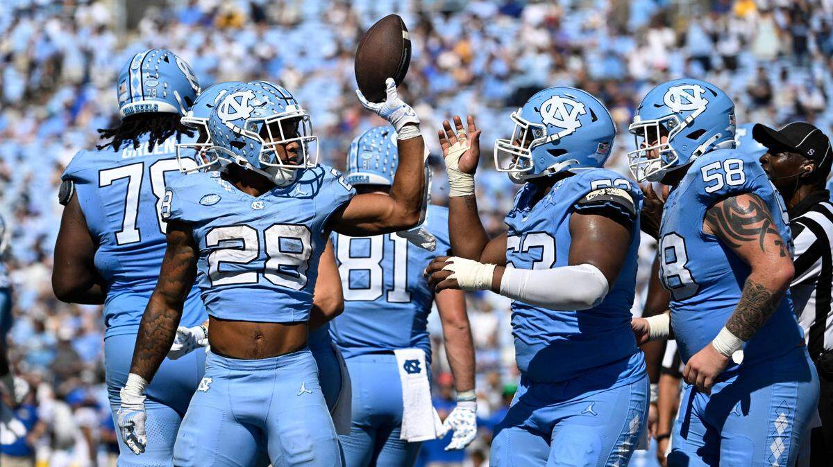 Oct 5, 2024; Chapel Hill, North Carolina, USA; North Carolina Tar Heels running back Omarion Hampton (28) with the ball after scoring a touchdown in the second quarter at Kenan Memorial Stadium. Mandatory Credit: Bob Donnan-Imagn Images
