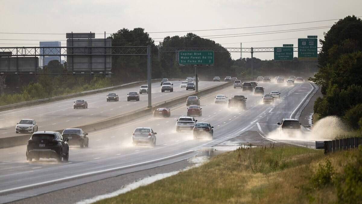 Vehicles kick up mist and steam on the I-440 Beltline in Raleigh on Thursday afternoon, June 11, 2026, after a brief downpour drenched parts of the Triangle. Temperatures in Raleigh reached 99 degrees Thursday, with heat index values pushing the "feels like" temperature above 106 degrees.