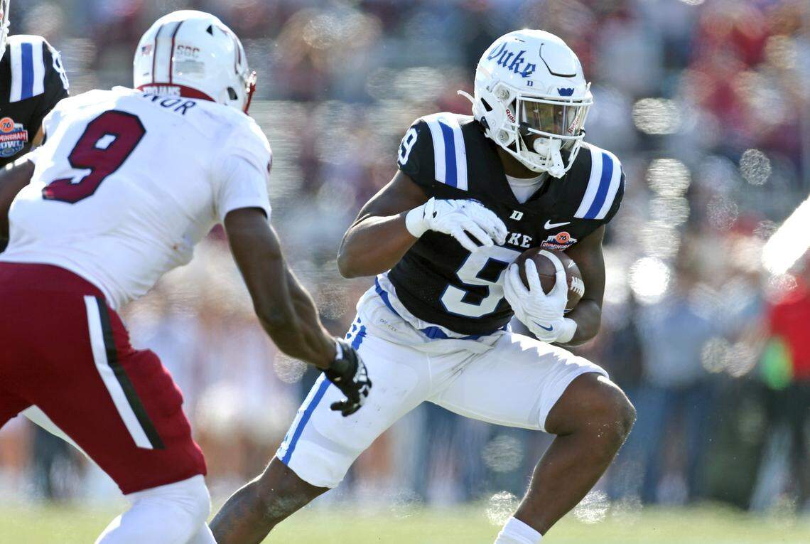 Duke Blue Devils running back Jaquez Moore (9) runs the ball during their bowl game against the Troy Trojans at Protective Stadium on Saturday, Dec. 23, 2023.