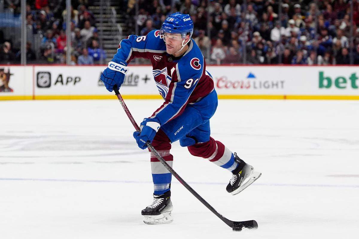 Colorado Avalanche right wing Mikko Rantanen (96) shoots the puck in the second period against the New York Rangers at Ball Arena.