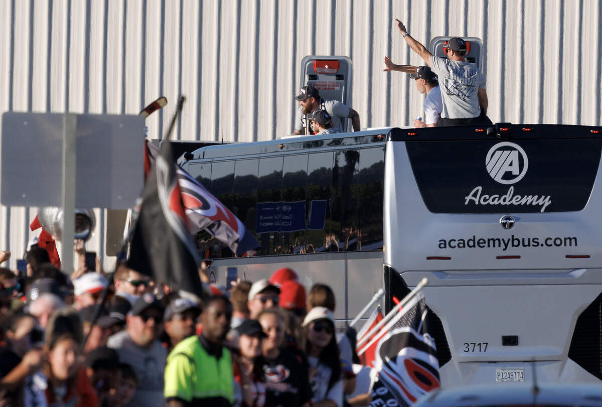Carolina Hurricanes players greet fans as they depart Raleigh-Durham International Airport on Monday, June 15, 2026, after defeating the Vegas Golden Knights to win the Stanley Cup.