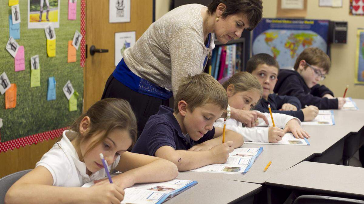 In this file photo, teacher Cindy Kusilek works with students in her third-grade class at Franklin Academy Charter School in Wake Forest.