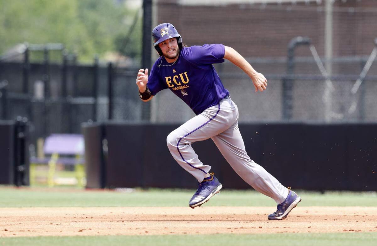 ECU’s Alec Burleson (19) heads towards second while running drills during East Carolina’s practice at Clark-LeClair Stadium in Greenville, N.C., Tuesday, May 28, 2019.