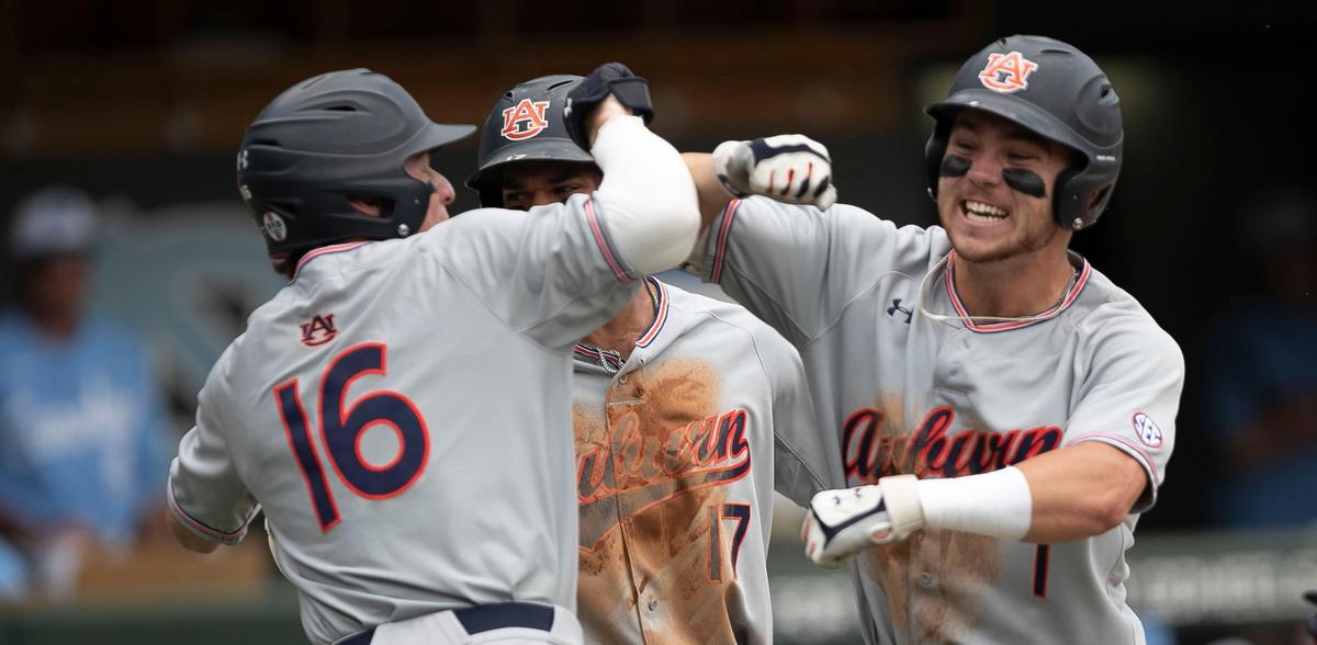 Auburn’s Judd Ward (1) celebrates at home plate with Kason Howell (16) after connecting for a 3-RBI home run in the first inning to give Auburn a 7-0 lead during the NCAA Super Regional on Monday, June 10, 2019 at Boshamer Stadium in Chapel Hill, N.C. Auburn scored another six runs in the first inning to take a commanding 13-0 lead over North Carolina.