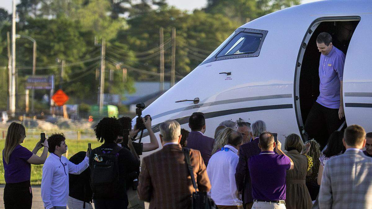 Will Wade emerges from a private plane to a crowd of LSU officials on Thursday, March 26, 2026 at the BTR Jet Center in Baton Rouge, Louisiana. 