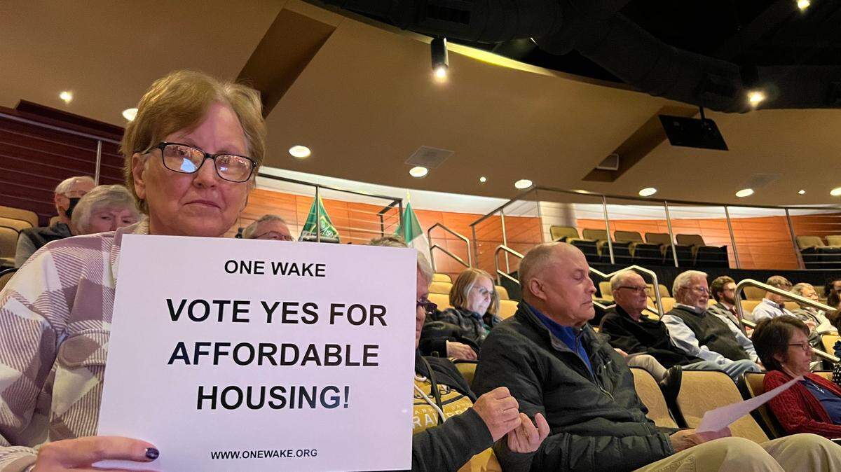 More than 20 people with the ONE Wake organization attended Cary’s Town Council meeting on Nov. 17, 2022 to show their support for the Council’s approval of an affordable housing development on SE Maynard Road.