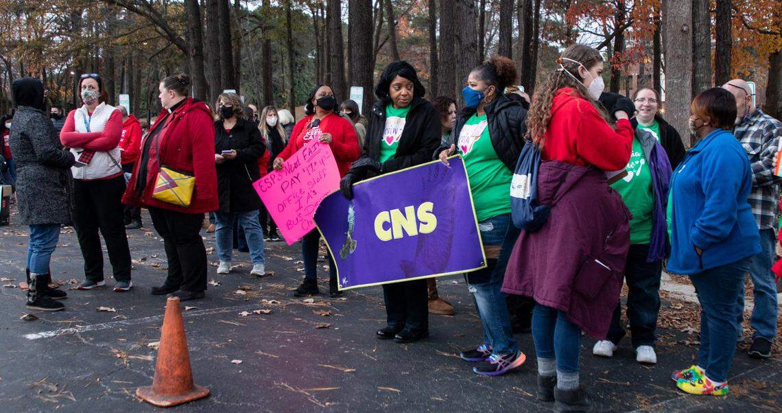 Educators, school support staff and their supporters rally outside the Wake County School Board meeting in Cary, N.C. on Tuesday, Dec. 7, 2021.
