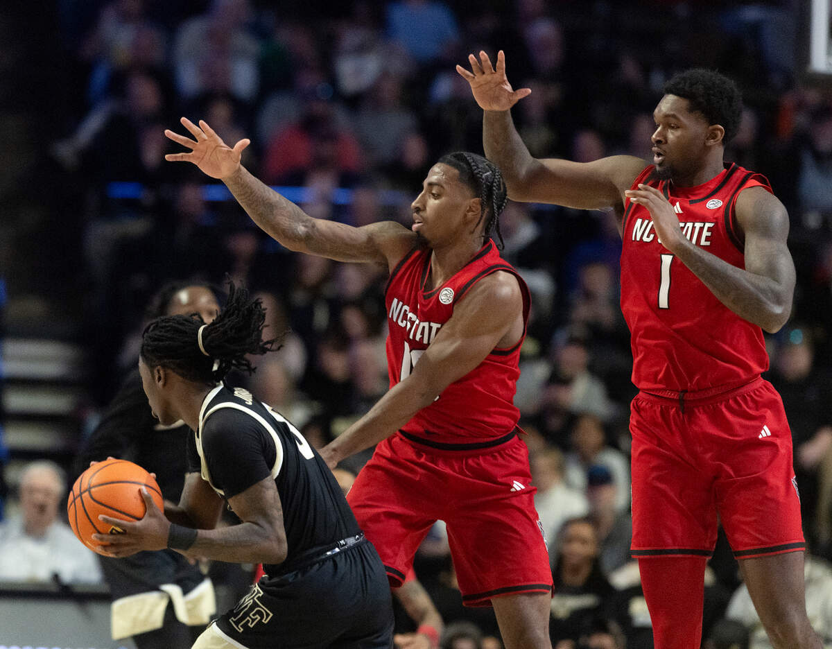 N.C. State’s Marcus Hill and Brandon Huntley-Hatfield pressure Wake Forest’s Ty-Laur Johnson during the second half of the Wolfpack’s 77-59 loss on Saturday, Jan. 4, 2025, at Lawrence Joel Veterans Memorial Coliseum in Winston-Salem, N.C.