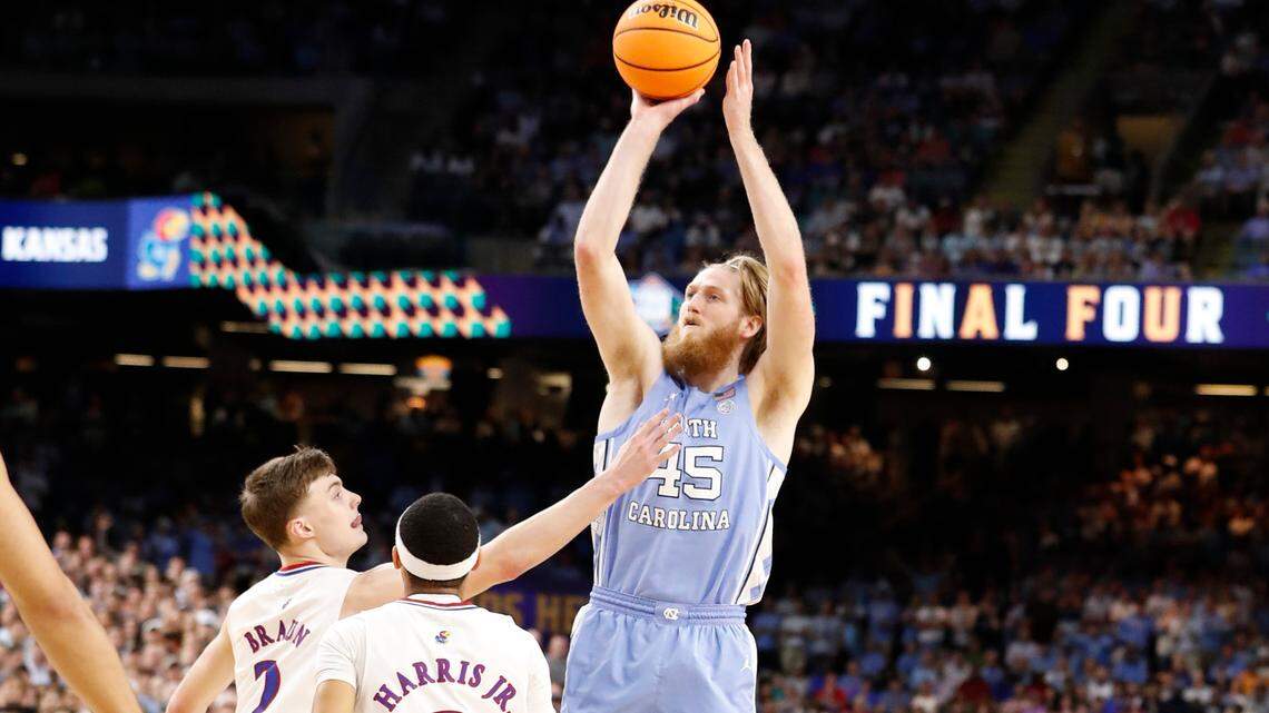 North Carolina’s Brady Manek (45) shoots as Kansas’ Christian Braun (2) defends during the first half of UNC’s game against Kansas in the NCAA Men’s National Championship at the Caesars Superdome in New Orleans, La., Monday, April 4, 2022.