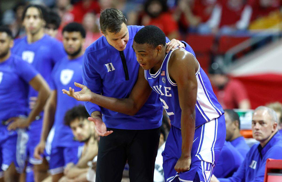 Duke head coach Jon Scheyer talks with Jaylen Blakes (2) during the second half of N.C. State’s 84-60 victory over Duke at PNC Arena in Raleigh, N.C., Wednesday, Jan. 4, 2023.