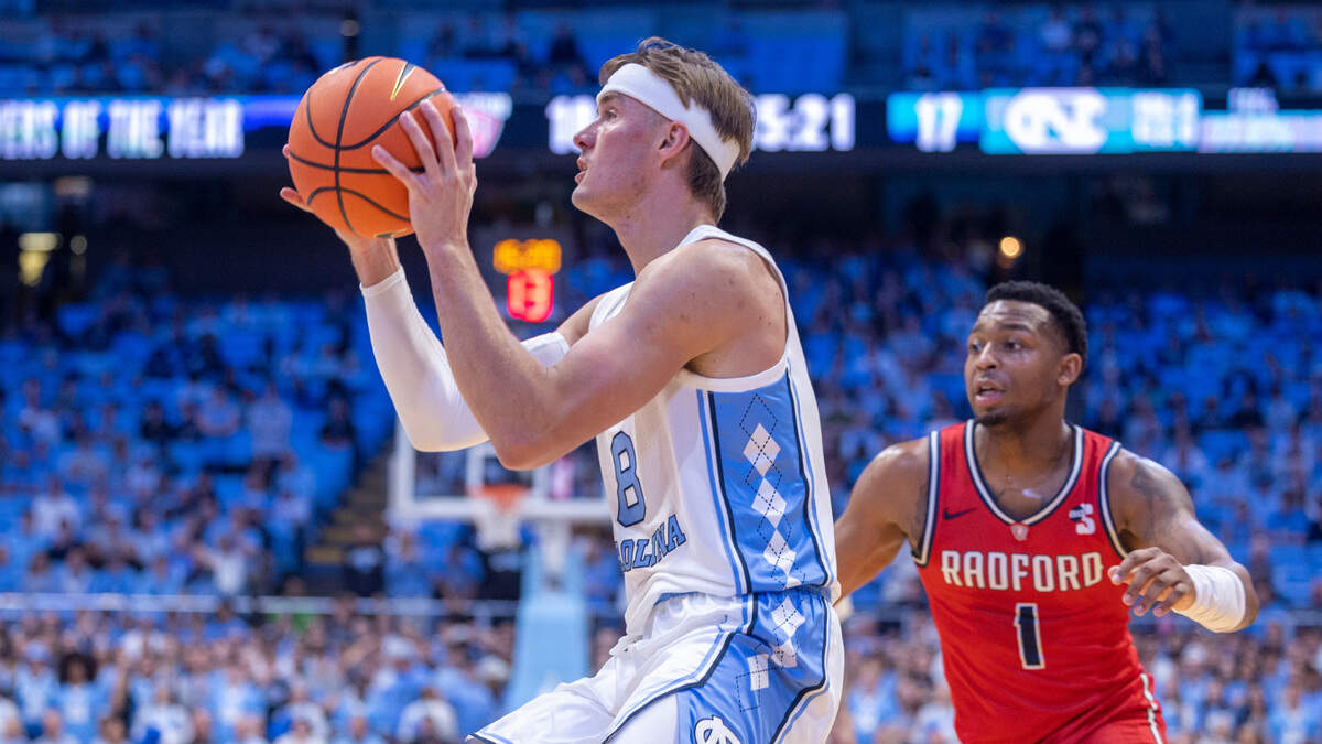 North Carolina’s Paxson Wojcik (8) breaks to the basket against Radford’s Daquan Smith (1) in the first half on Monday, November 6, 2023 at the Dean Smith Center in Chapel Hill, N.C.