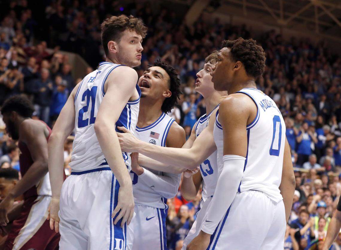 Duke’s Tre Jones (3), Alex O’Connell (15), and Wendell Moore Jr. (0) celebrate after Duke’s Matthew Hurt pulled in the offensive rebound while being fouled with 11 seconds left in the game during Duke’s 70-65 victory over Florida State at Cameron Indoor Stadium in Durham, N.C., Monday, Feb. 10, 2020.