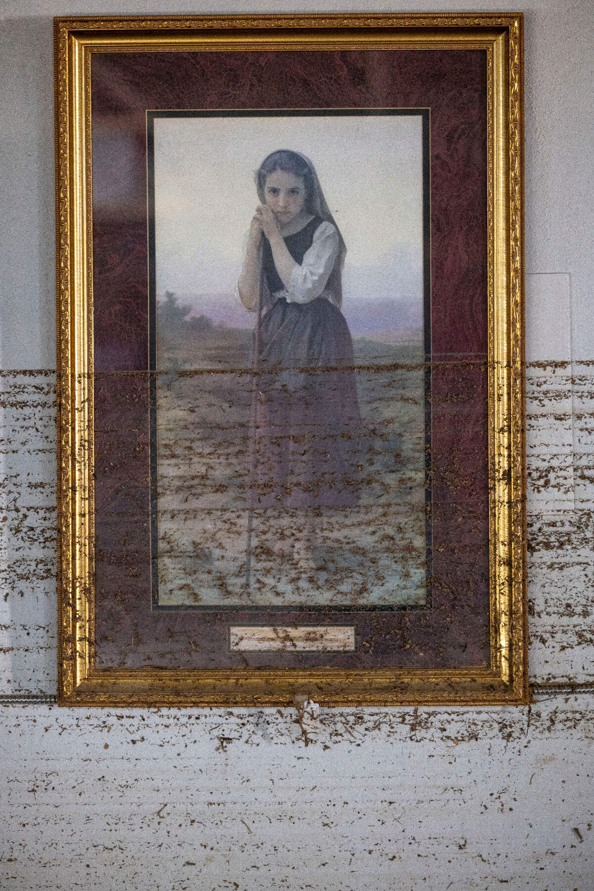 Debris from Hurricane Helene flood waters left a mark on this image, ‘The Lord is my shepherd’, from Psalm 23. The framed image hangs in a former antique mall in the former Taylor Toggs manufacturing plant, which had been converted into a mixed use building in Micaville, N.C.