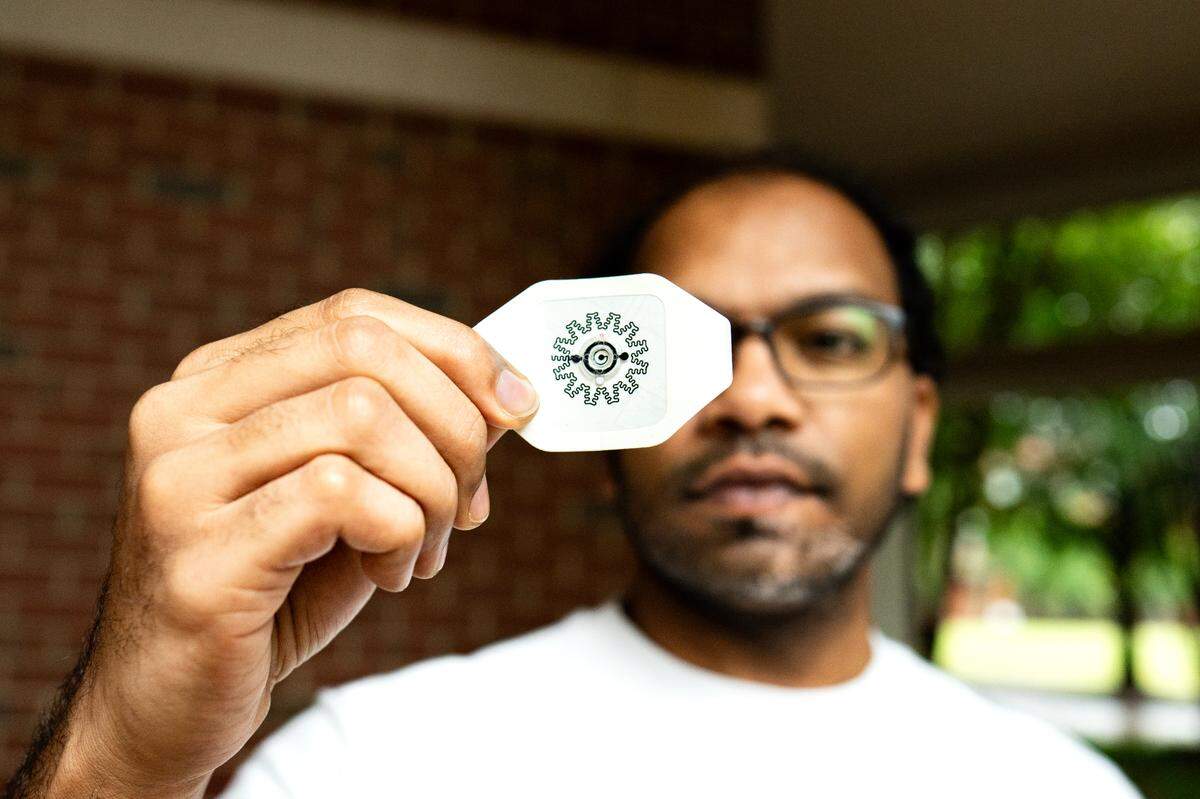 A team of NC State scientists developed a new small adhesive bandage that is activated by water. The electric bandage, held by postdoctoral researcher Rajaram Kaveti, recently received funding from NCInnovation. 
