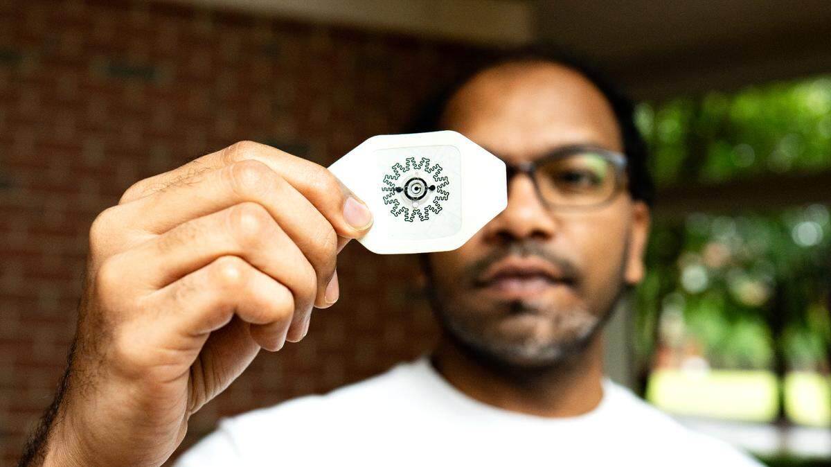 A team of NC State scientists developed a new small adhesive bandage that is activated by water. The electric bandage, held by postdoctoral researcher Rajaram Kaveti, recently received funding from NCInnovation.