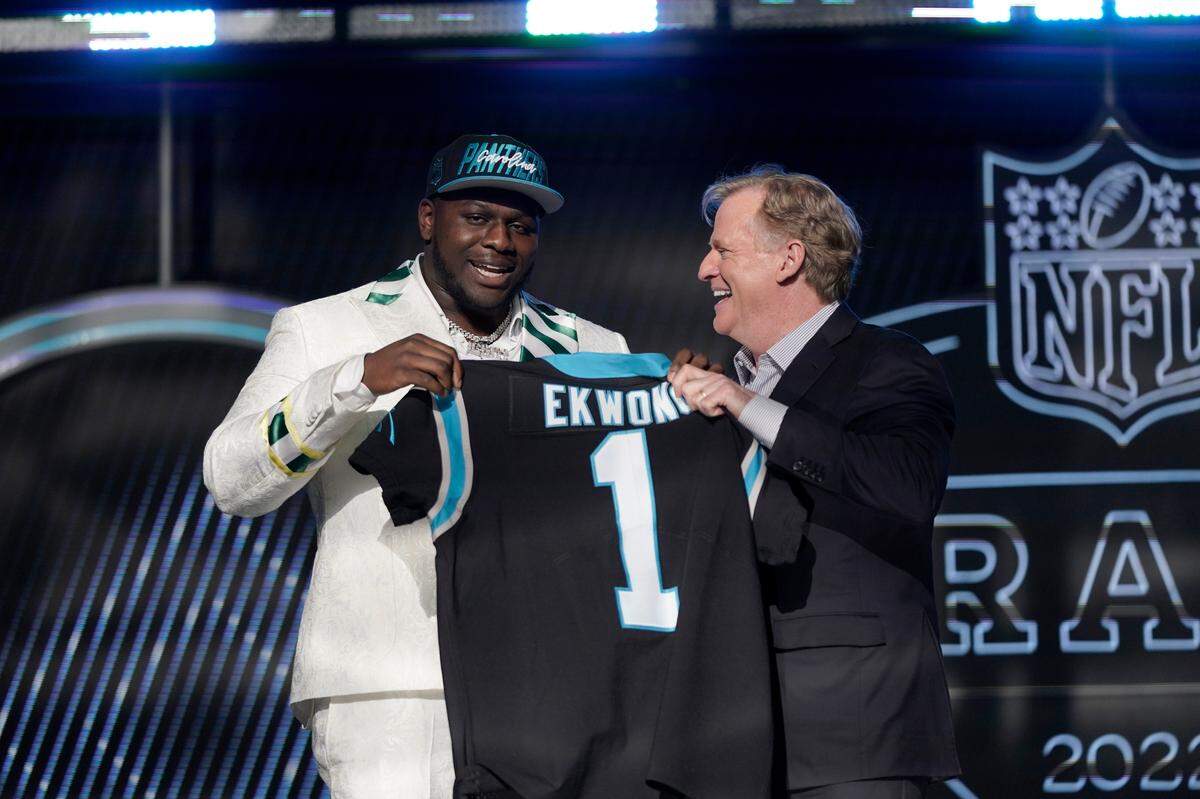 North Carolina State offensive tackle Ikem Ekwonu stands with NFL Commissioner Roger Goodell after being picked by the Carolina Panthers with the sixth pick of the NFL football draft Thursday, April 28, 2022, in Las Vegas. (AP Photo/Jae C. Hong)