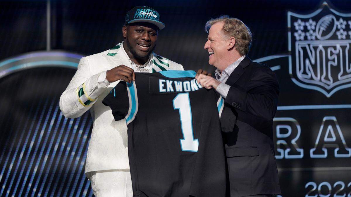 North Carolina State offensive tackle Ikem Ekwonu stands with NFL Commissioner Roger Goodell after being picked by the Carolina Panthers with the sixth pick of the NFL football draft Thursday, April 28, 2022, in Las Vegas. (AP Photo/Jae C. Hong)