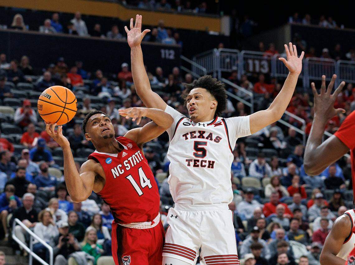 N.C. State’s Casey Morsell drives to the basket past Texas Tech’s Darrion Williams during the first half of the Wolfpack’s first round NCAA Tournament game on Thursday, March 21, 2024, at PPG Paints Arena in Pittsburgh, Pa.