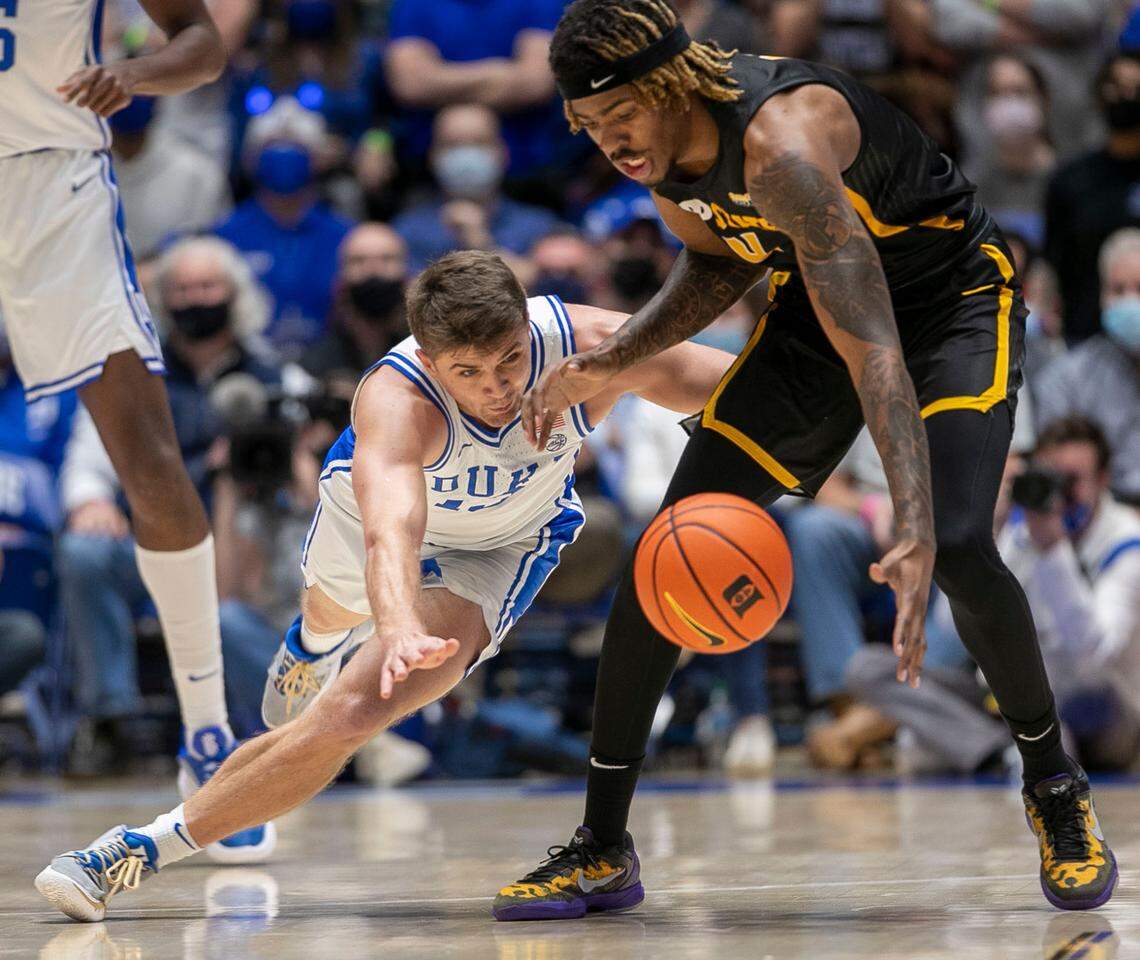 Duke’s Joey Baker (13) works for a steal from Appalachian State’s R.J. Duhart (4) during the first half on Wednesday, Thursday 16, 2021 at Cameron Indoor Stadium in Durham, N.C.