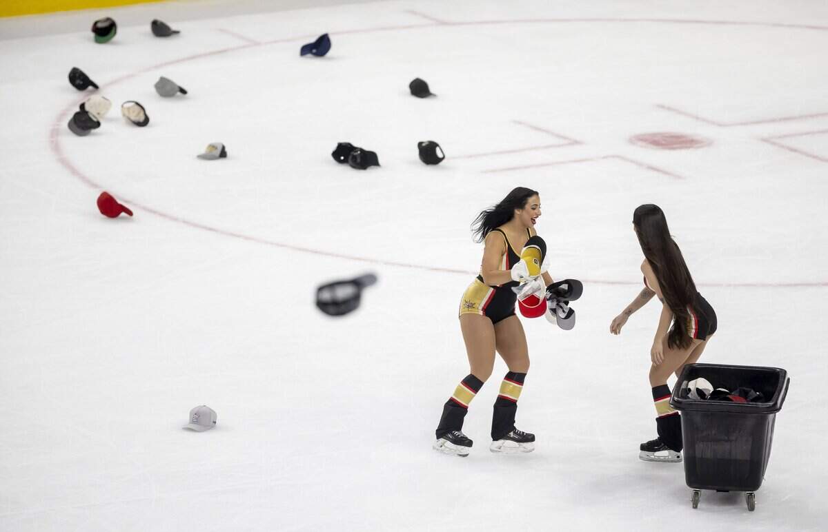 The Vegas ice crew removes hats from the ice after a hat trick by right wing Mitch Marner (93) to take a 4-0 lead over the Carolina Hurricanes in Game 3 of the Stanley Cup Final, on Saturday, June 6, 2026 at T-Mobile Arena in Las Vegas, NV.