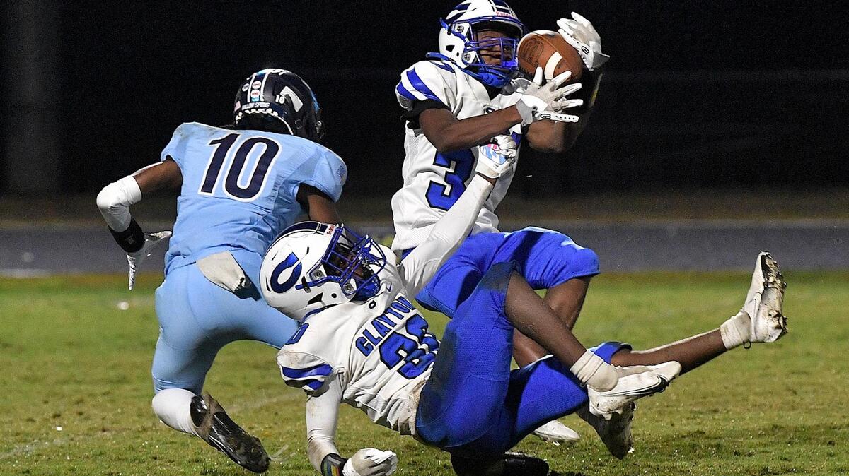 Clayton’s Mekhi Foye (37) makes the pass interception against Willow Spring’s Cameron Howard (10) during the first half. The Clayton Comets and the Willow Spring Storm met in a conference football game in Fuquay-Varina, N.C. on October 20, 2023.