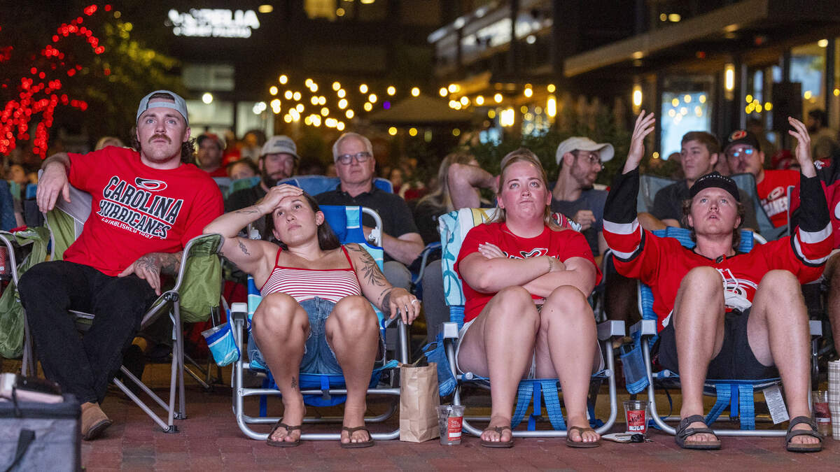 Carolina Hurricanes fans react during a Stanley Cup Final watch party in Raleigh's Smoky Hollow district on Tuesday, June 9, 2026, as the Hurricanes play the Vegas Golden Knights in Game 4 of the Stanley Cup Final.