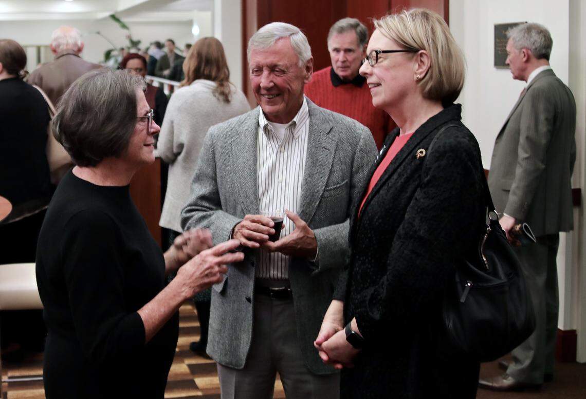 N.C. Symphony CEO Sandi MacDonald (right) talks with patrons Sharon and Tom Yancey during the intermission of the symphonyÕs Christmas Pops concert in Raleigh, N.C. on December 14, 2019.