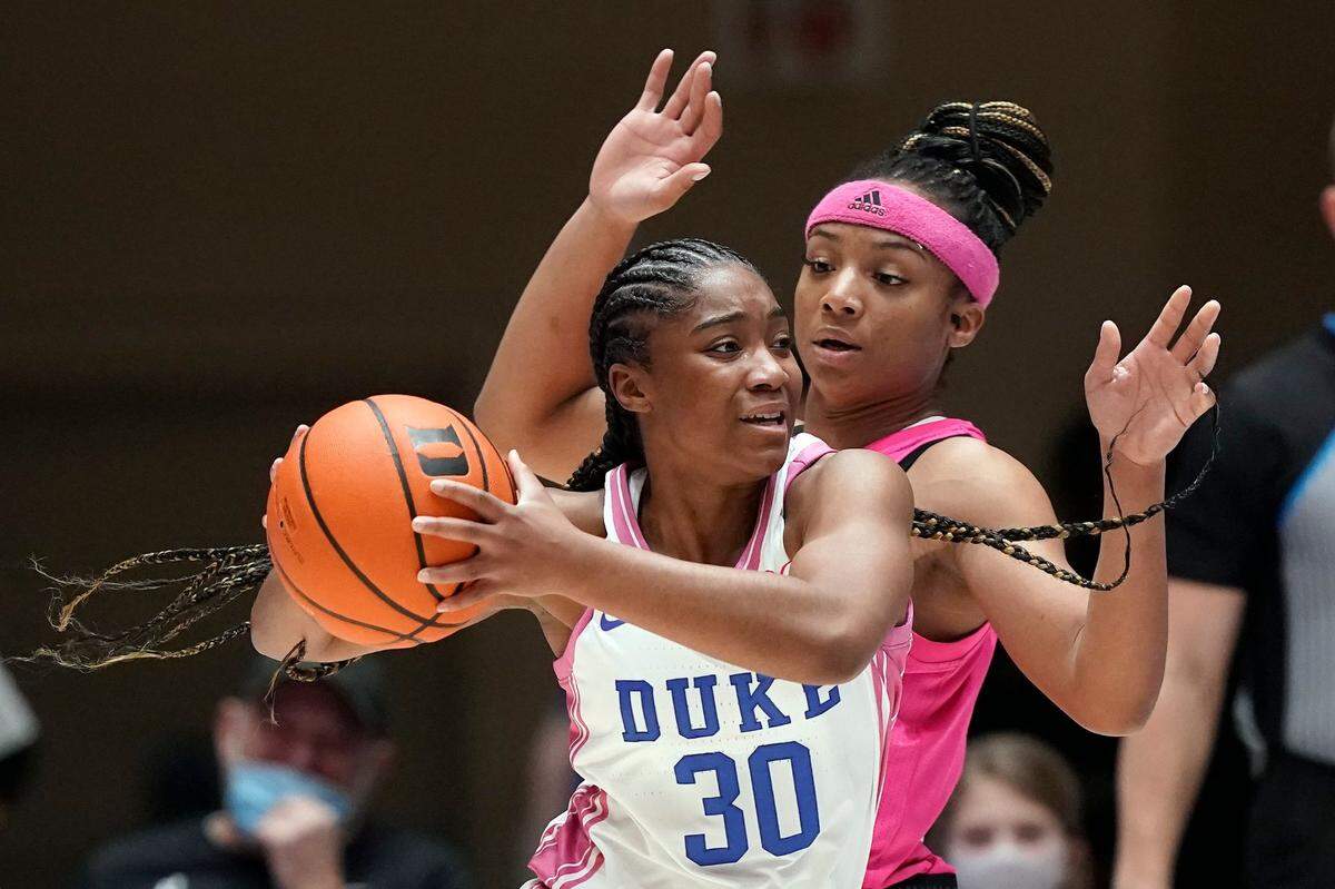 Duke guard Shayeann Day-Wilson (30) is pressured by North Carolina State guard Kai Crutchfield during the first half of an NCAA college basketball game in Durham, N.C., Sunday, Feb. 13, 2022. (AP Photo/Gerry Broome)