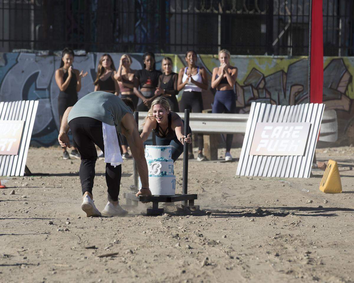 Colton Underwood, left, with Raleigh’s Nina Bartula, right, at the Bachelor’s Strongest Woman competition on the Jan. 21 episode of “The Bachelor.”