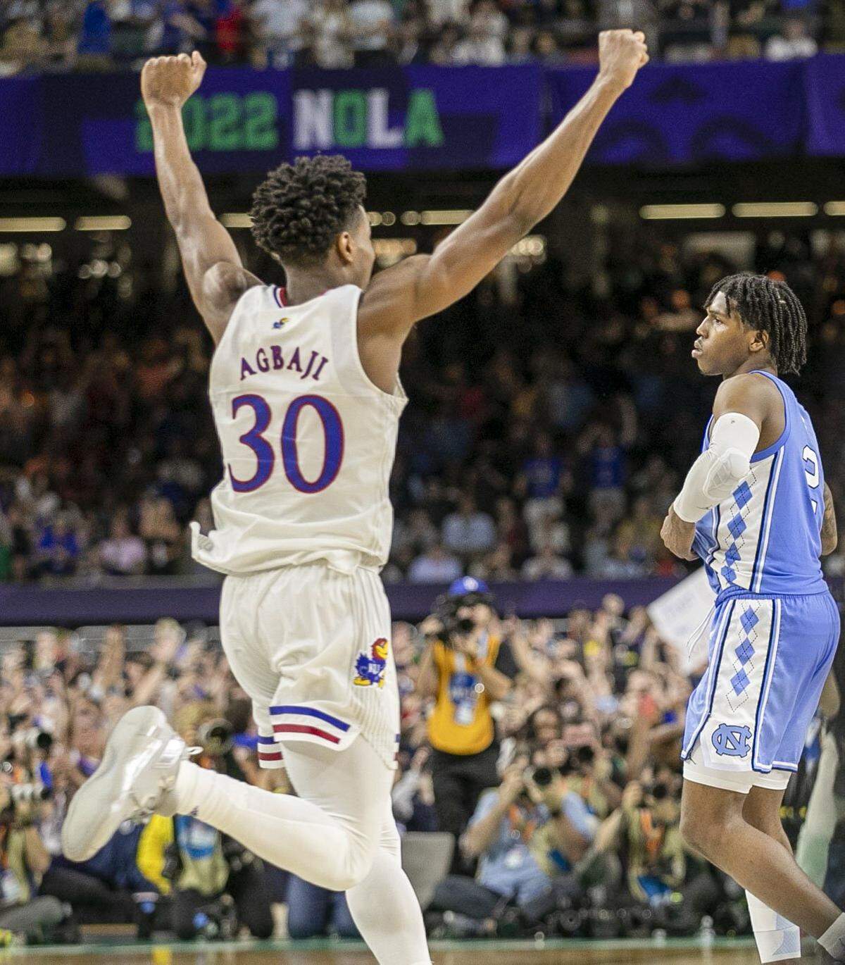 Ochai Agbaji (30) celebrates the Jayhawks 72-69 victory after North Carolina’s Caleb Love (2) missed a three-point shot with 2.1 seconds to play during the NCAA Championship game on Monday, April 4, 2022 at Caesars Superdome in New Orleans, La.