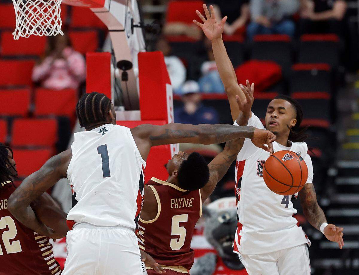 N.C. State’s Brandon Huntley-Hatfield blocks a shot by Boston College’s Fred Payne during the second half of the Wolfpack’s 70-62 win on Saturday, Feb. 15, 2025, at Lenovo Center in Raleigh, N.C.