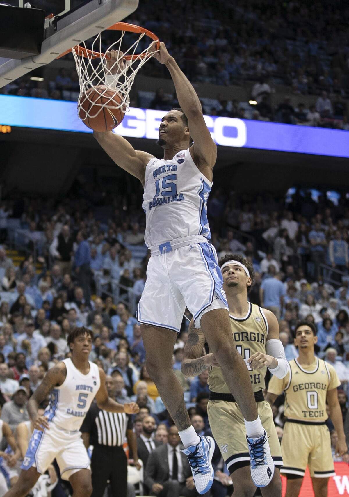 North Carolina’s Garrison Brooks (15) gets a dunk over Georgia Tech’s Jordan Usher (4) in the second half for two of his career high 35 points in the Tar Heels’ 96-83 loss to Georgia Tech on Saturday, January 4, 2020 at the Smith Center in Chapel Hill, N.C.