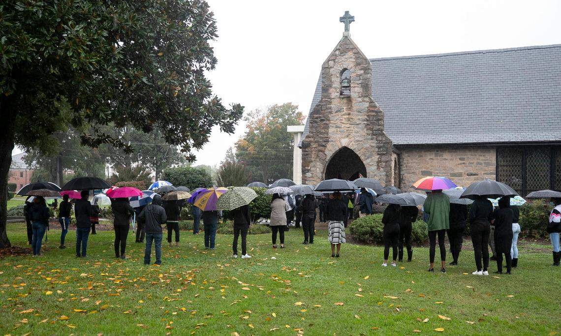 St. Augustine’s faculty and students gather for prayer outside their chapel on Friday, October 16, 2020 in Raleigh, N.C. to honor St. Augustine’s University President Dr. Irving McPhail who died yesterday from COVID-19.