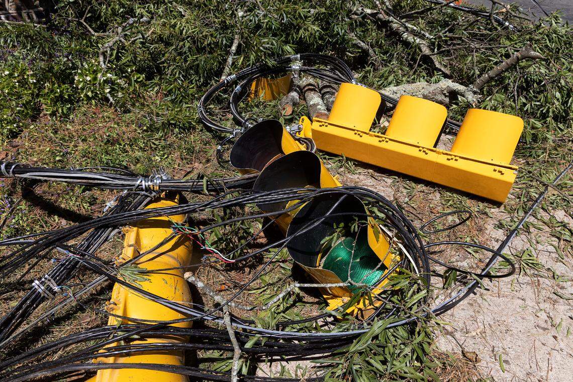 Stoplights and power lines sit on the ground near the intersection of Science Drive and Cameron Boulevard on Wednesday, Aug. 16, 2023, following Tuesday evening’s strong storms in Durham, N.C.