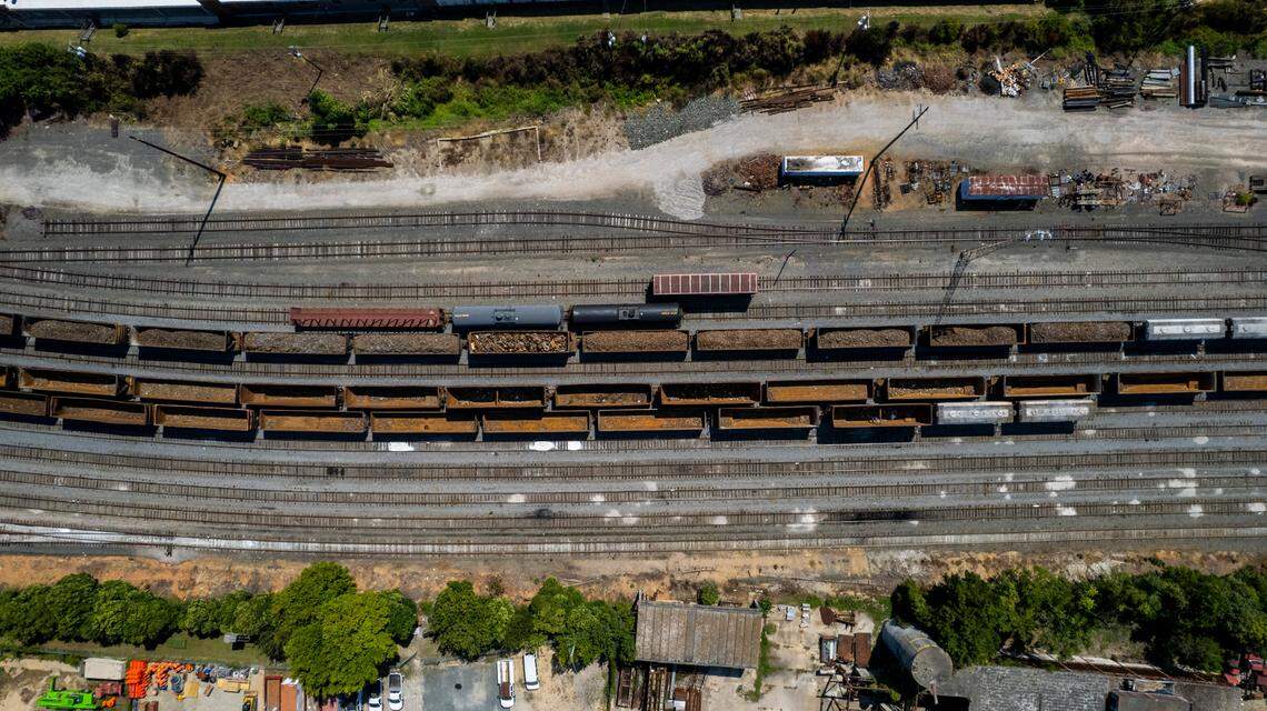 Hoppers and boxcars sit on the tracks in the Norfolk Southern rail yard near downtown Raleigh Wednesday, Sept. 14, 2022. A labor dispute between the nation’s freight railroads and two unions representing many of their employees could bring passenger trains to a halt in North Carolina.