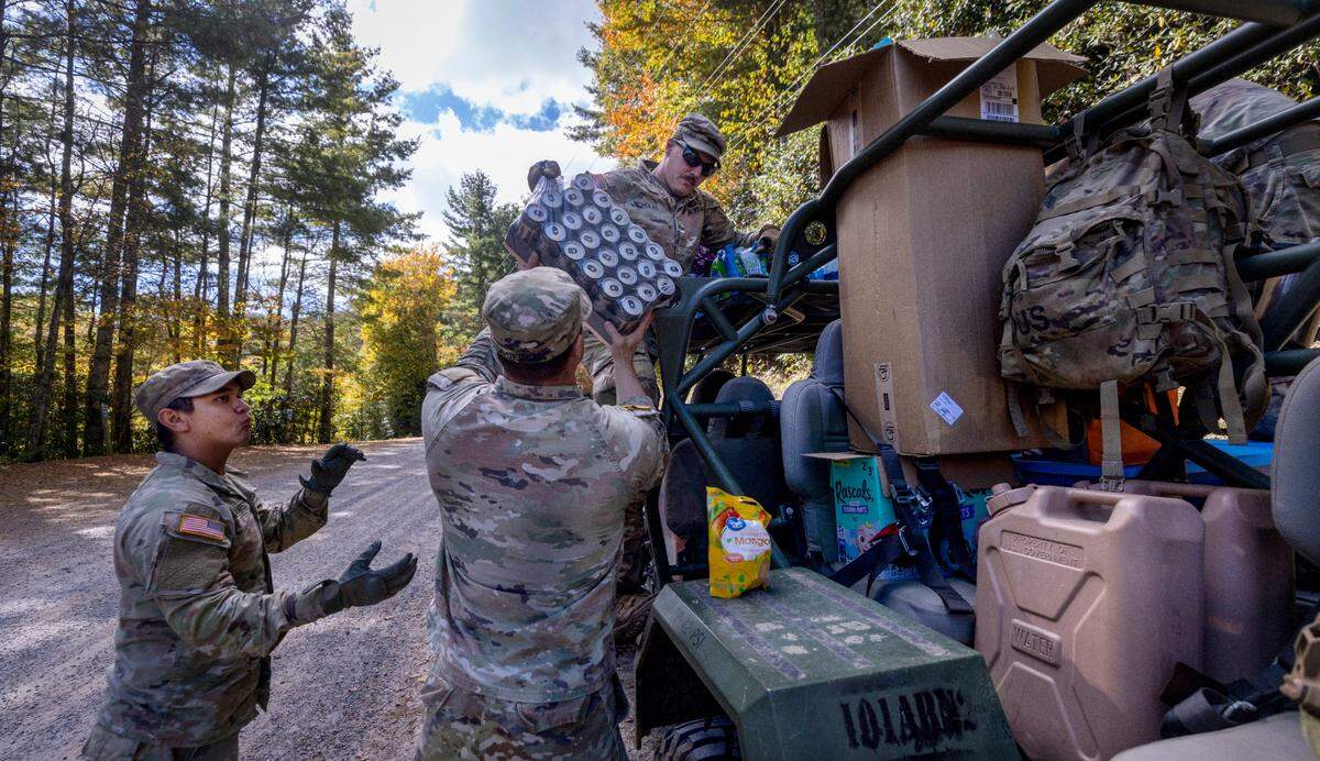 Soldiers with the 101st Airborne Division Air Assault, 2nd Brigade Combat Team, from Fort Campbell, Kentucky, use Infantry Squad Vehicles to deliver water, food, toiletries, and other aid to residents in the Soco Gap community in Maggie Valley on Tuesday, October. 8, 2024. The team has been using the Maggie Valley Pavilion and Town Hall as a distribution base for relief efforts in the town following Tropical Storm Helene.