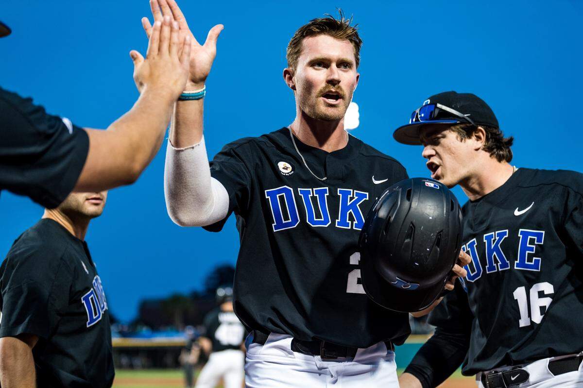 Duke designated hitter MJ Metz (middle) celebrates with his teammates during the NCAA Tournament Conway Regional. Metz blasted four home runs in the regional for the Blue Devils.