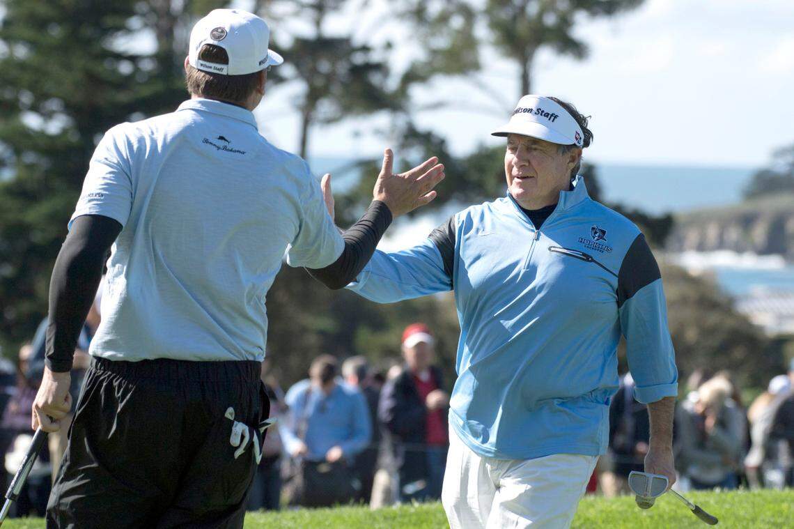 Bill Belichick, right, congratulates Ricky Barnes on the second hole during the third round of the AT&T Pebble Beach Pro-Am golf tournament at Pebble Beach Golf Links in February 2017.