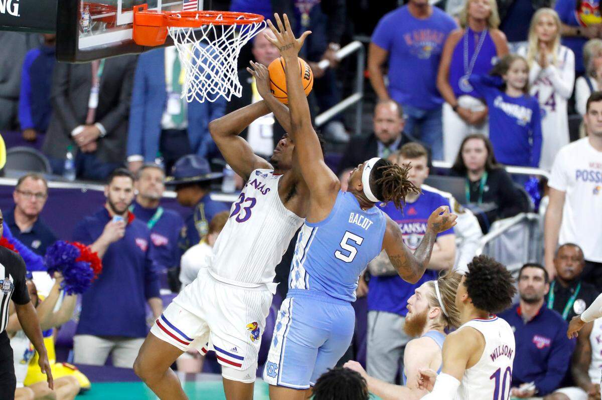 North Carolina’s Armando Bacot (5) blocks the shot by Kansas’ David McCormack (33) during the second half of Kansas’ 72-69 victory over UNC in the NCAA Men’s National Championship at the Caesars Superdome in New Orleans, La., Monday, April 4, 2022.