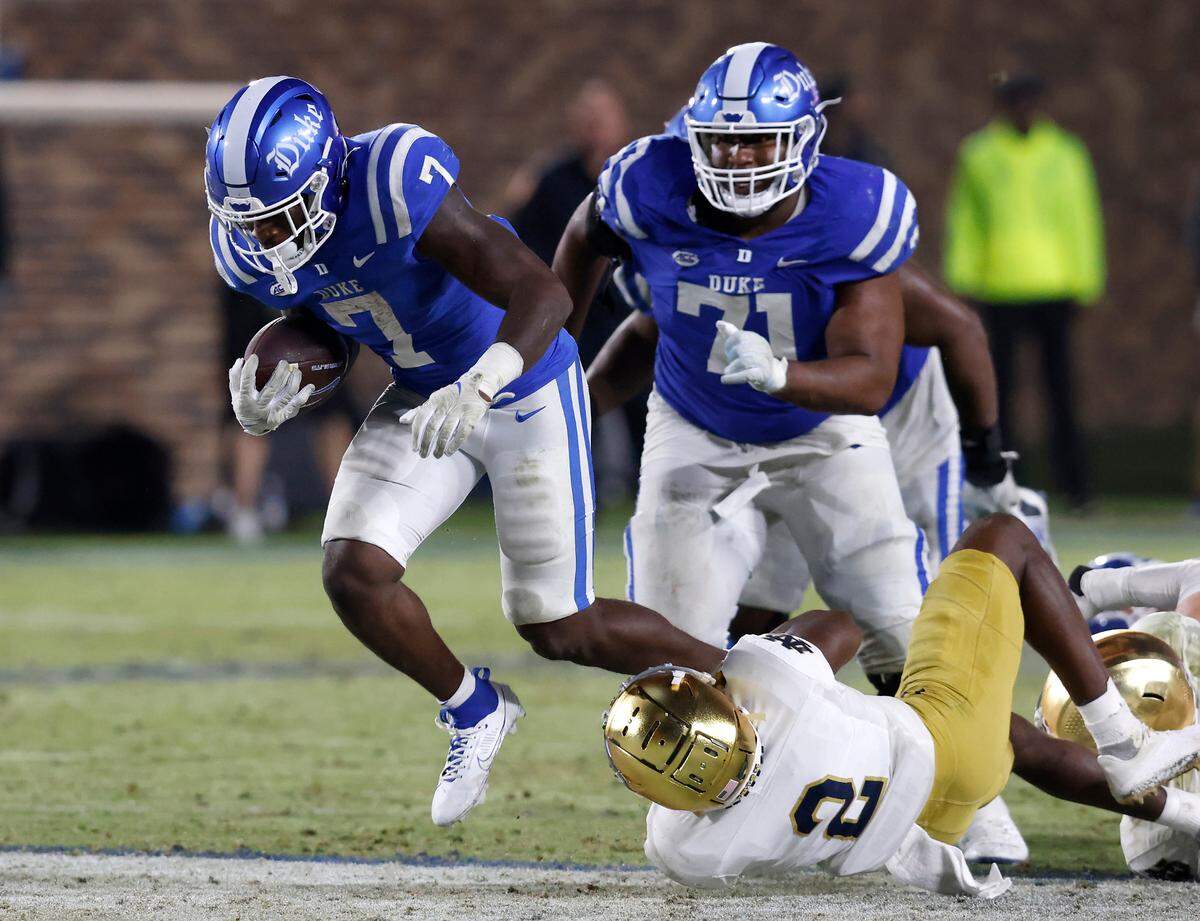 Duke’s Jordan Waters is brought down by Notre Dame’s DJ Brown during the second half of the Blue Devils’ 21-14 loss at Wallace Wade Stadium on Saturday, Sept. 30, 2023, in Durham, N.C.