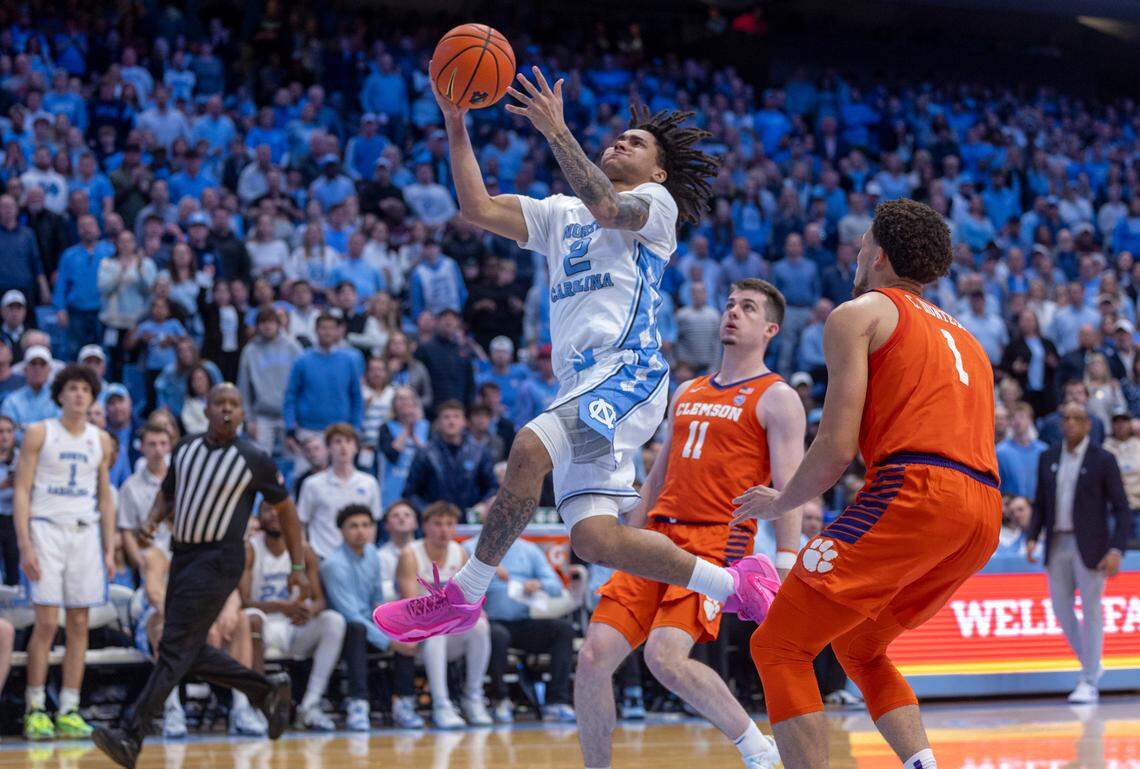 North Carolina’s Elliot Cadeau (2) breaks to the basket past Clemson’s Joseph Girard III (11) and Chase Hunter (1) in the second half on Tuesday, February 6, 2024 at the Dean E. Smith Center in Chapel Hill, N.C.