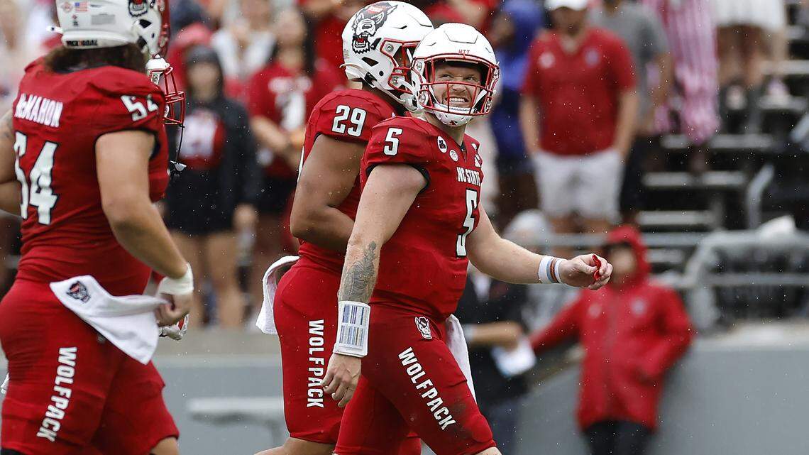 N.C. State quarterback Brennan Armstrong (5) looks to the scoreboard as he walks off the field after throwing an interception during the first half of N.C. State’s game against Notre Dame at Carter-Finley Stadium in Raleigh, N.C., Saturday, Sept. 9, 2023.