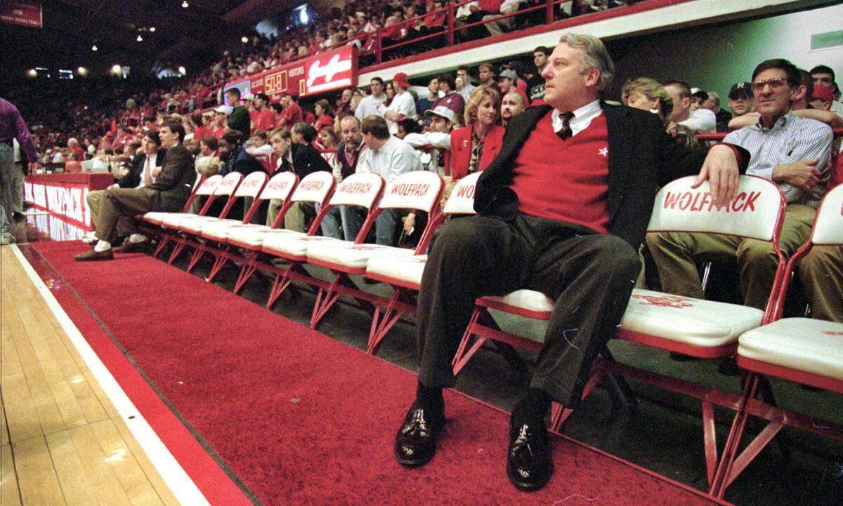 NC State head coach Les Robinson waits for the start of the final home game against Wake Forest in 1996 at Reynolds Coliseum in Raleigh. The ACC tournament play-in game in the 1990s was unofficially named after Robinson.